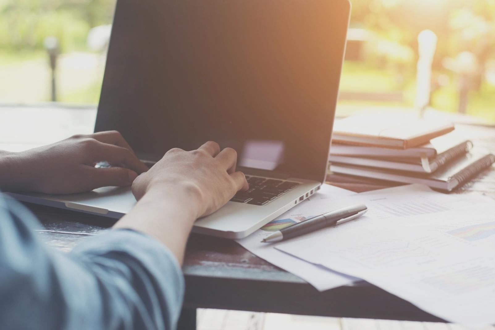 Financial professionals collaborating on market analysis using modern technology